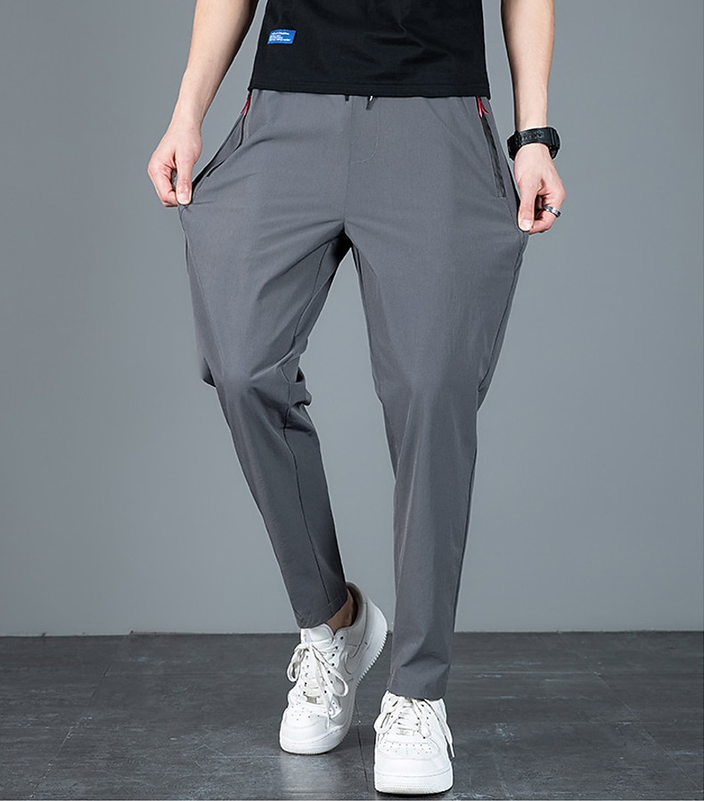 Per uomo Pantaloni Pantaloni casual Pantaloni elasticizzati A cordoncino Vita elastica Tasca con cerniera Tinta unica Asciugatura rapida Giornaliero Abbigliamento di strada Classico Casuale / sportivo del 2026 a $14.99 –P7