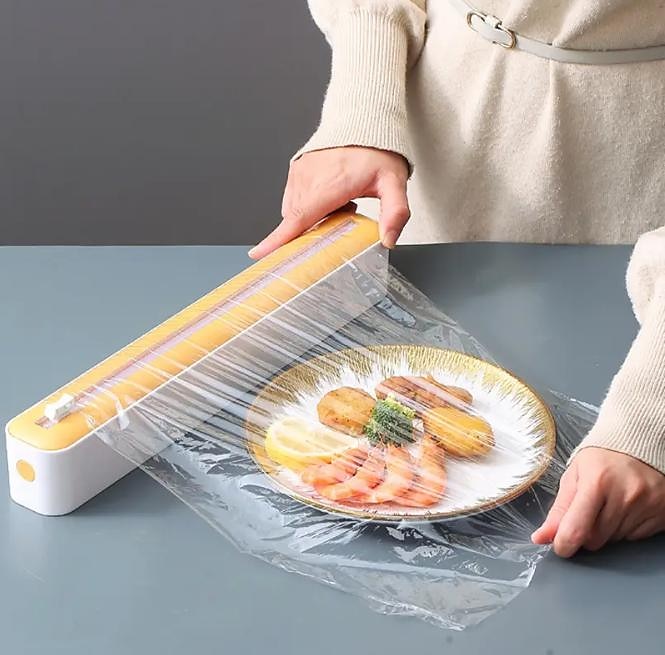 2 i 1 plastfolie dispenser matfilm dispenser cutter saran wrap dispenser aluminiumsfolie pergament papir injektor kjøkkenverktøy 2025 - $9.99 -P1