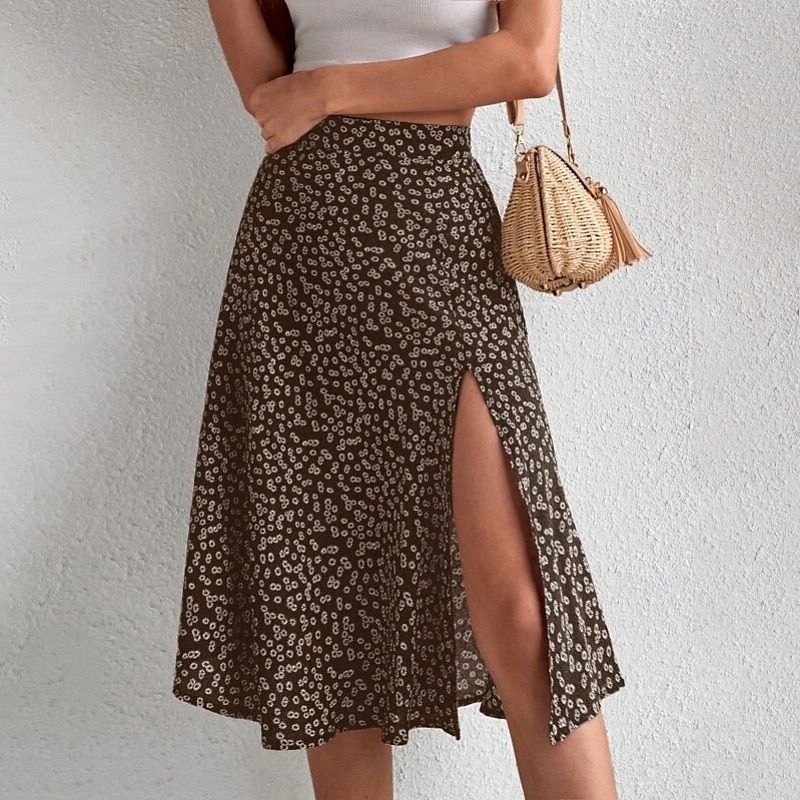 Dame الالتفاف A-linje Fritid Knelang Mellomhøyt liv Skjørt Blomstret Trykt mønster Mikroelastisk Feriereise Gate Svart Gul Blå Oransje Sommer Polyester 2025 - $21.99 –P14