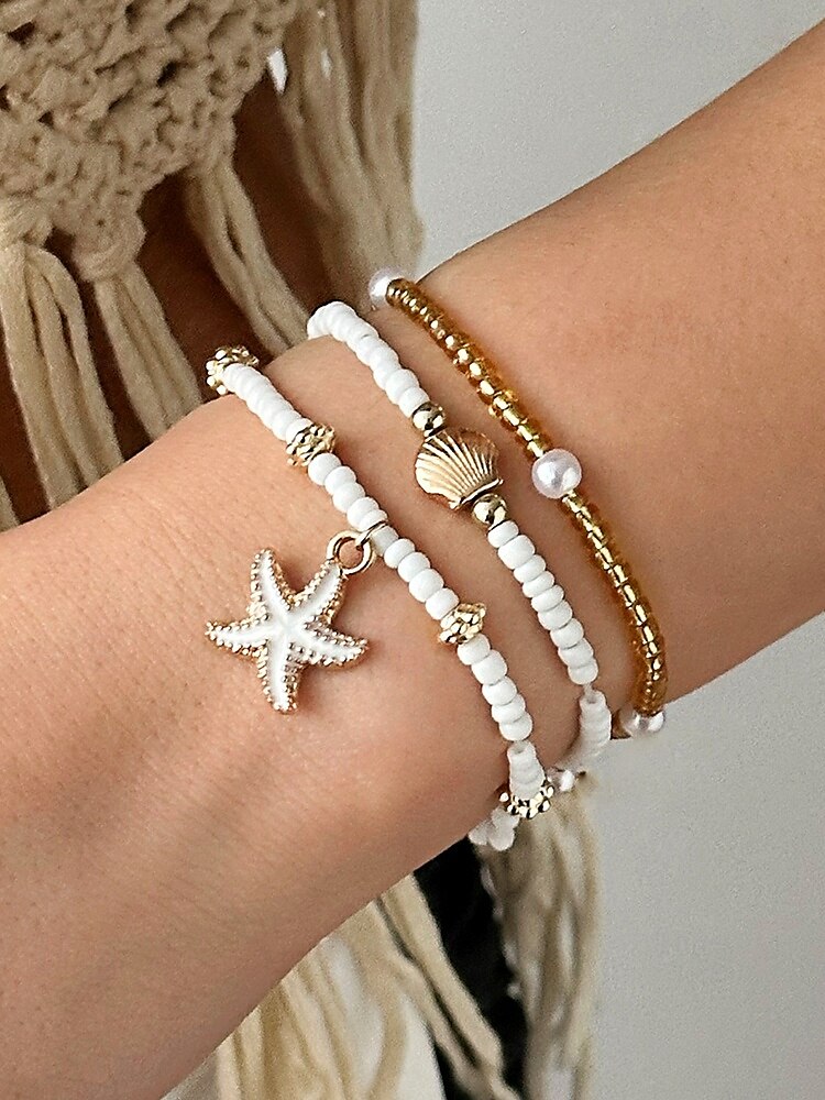 Conjunto de collar y pulsera tobillera en capas estilo playa para mujer con dijes de estrellas de mar y conchas, diseño de cuentas doradas y blancas, adecuado para vacaciones de verano, estilo casual y bohemio. 2025 - $9.99 –P3