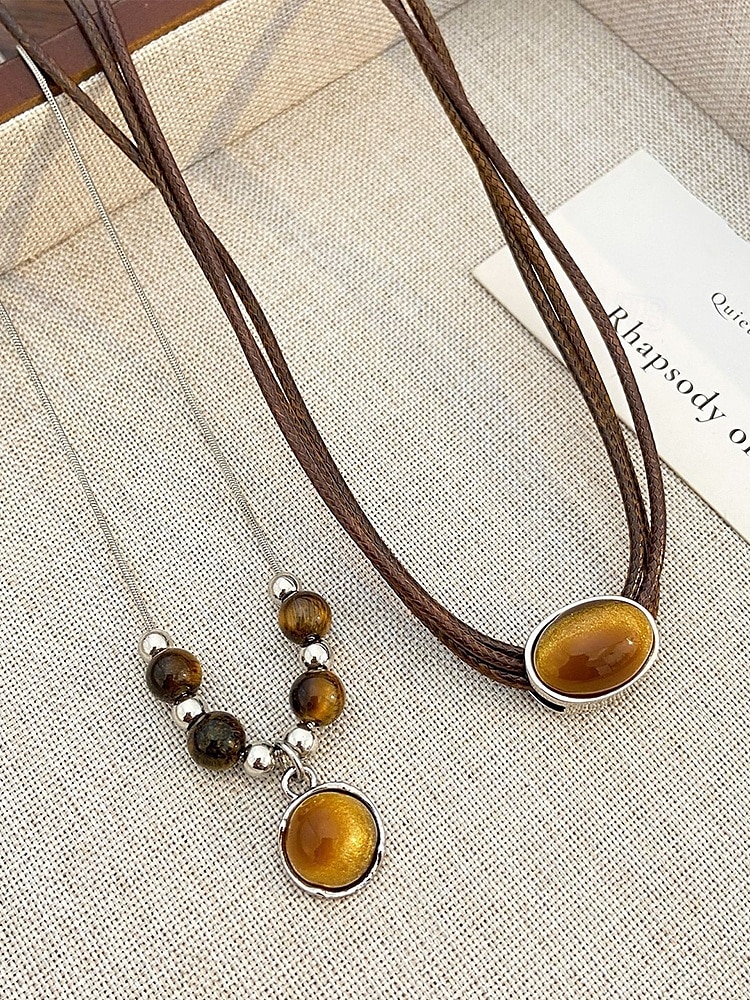 Ensemble de colliers et pendentifs en pierre œil de tigre double couche de style bohème pour femmes, matériau en pierre naturelle, adapté aux tenues décontractées, quotidiennes et de fête de 2025 ? $9.99 –P5