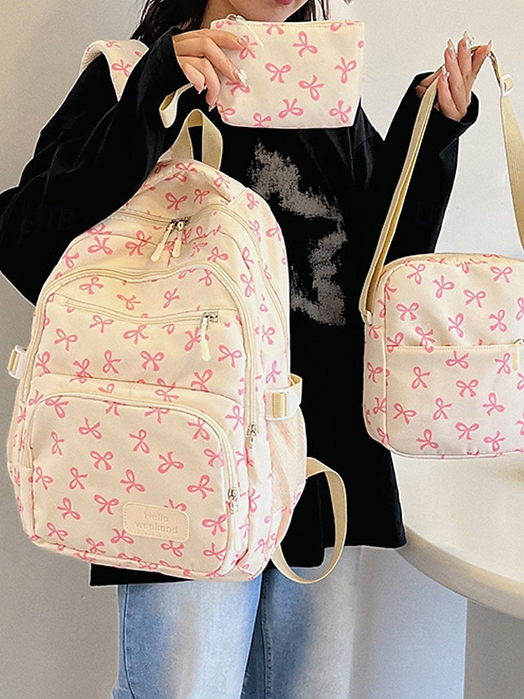 Set di 3 zaini scolastici per ragazze adolescenti: zaino in tela leggero con stampa di un grazioso fiocco rosa, borsa a tracolla di grande capacità e astuccio per matite, perfetto per la scuola, i viaggi e l'uso quotidiano. del 2025 a $26.99 –P1