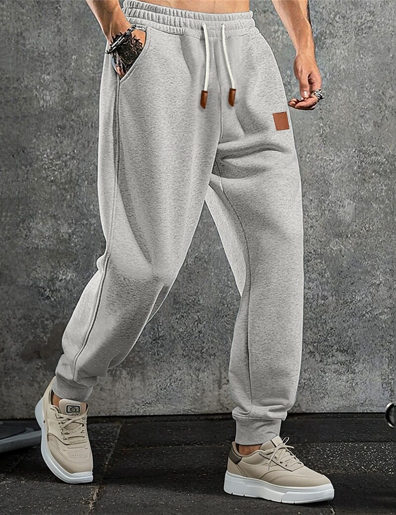 Homme Pantalon en polaire Joggings Joggeurs Pantalon Jogger Pantalons Cordon de serrage Uni Confort Doux Longueur complète Extérieur Quotidien Sortir Vacances Mode Noir bleu marine Élastique de 2025 ? $17.99 –P1