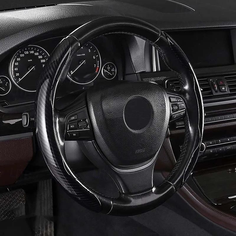 Funda antideslizante de silicona y fibra de carbono para volante de coche, ajuste universal, elegante, antideslizante, con agarre suave, para la decoración interior del coche y un cómodo accesorio de conducción. 2026 - $19.99 –P2