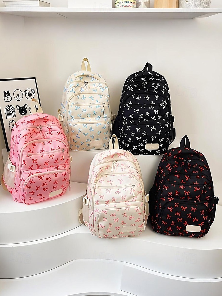 Set di 3 zaini scolastici per ragazze adolescenti: zaino in tela leggero con stampa di un grazioso fiocco rosa, borsa a tracolla di grande capacità e astuccio per matite, perfetto per la scuola, i viaggi e l'uso quotidiano. del 2025 a $26.99 –P13