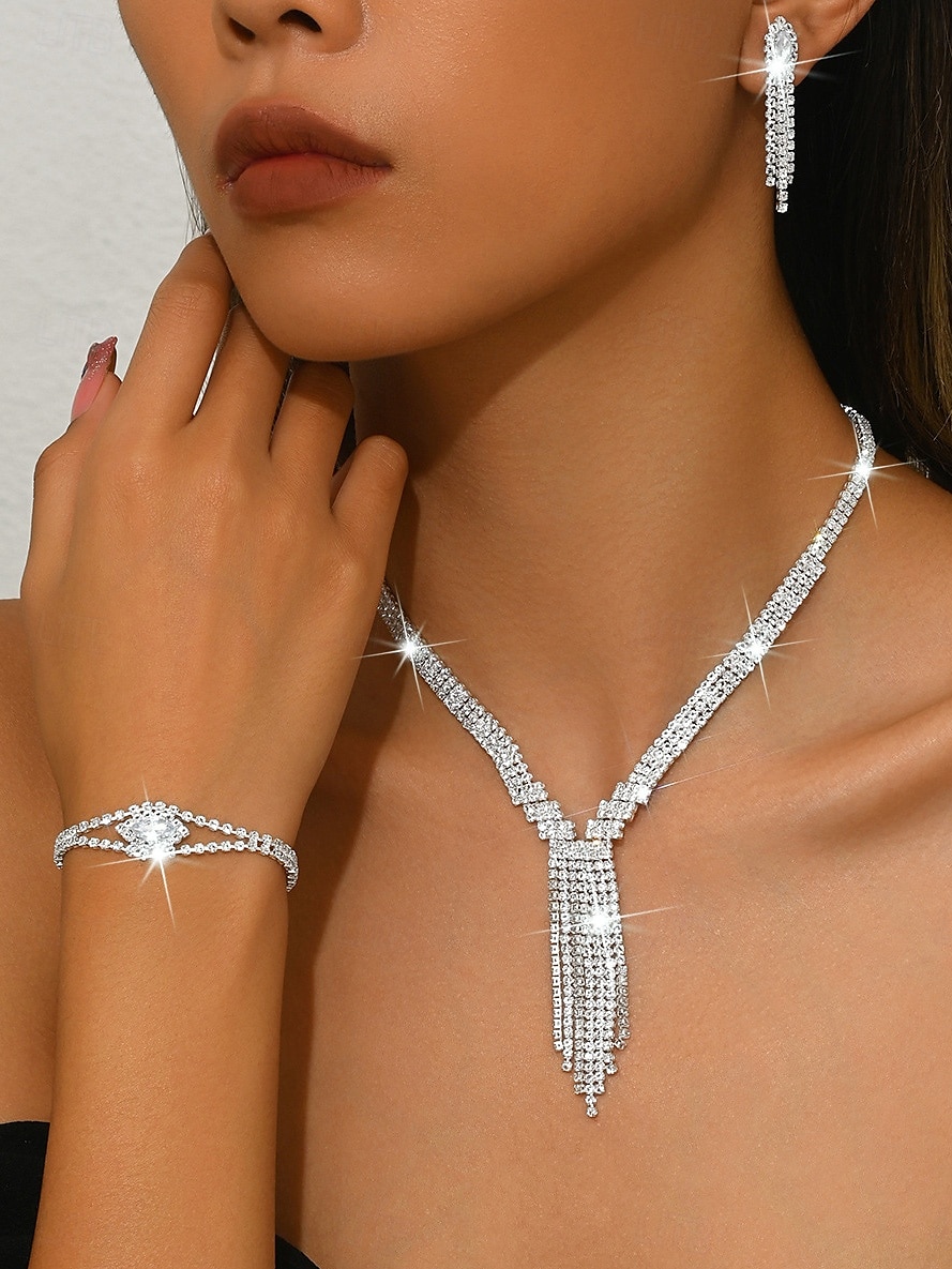 Set met fonkelende strass-sieraden voor dames - elegante zilveren ketting, armband, oorbellen en ring, luxe statement accessoires voor avonddansen en cocktailparty's 2026 - $14.99 –P1