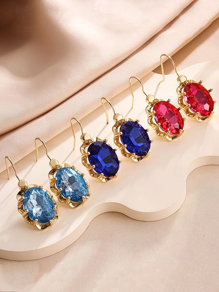 Boucles d'oreilles pendantes de Noël pour femmes avec de grandes pierres précieuses en cristal ovales, bijoux pendants élégants de couleur dorée, accessoires de fête festifs de 2025 ? $7.99 –P4