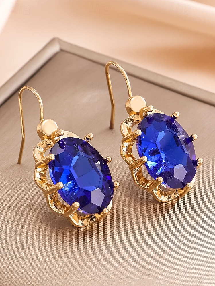 Boucles d'oreilles pendantes de Noël pour femmes avec de grandes pierres précieuses en cristal ovales, bijoux pendants élégants de couleur dorée, accessoires de fête festifs de 2025 ? $7.99 –P7