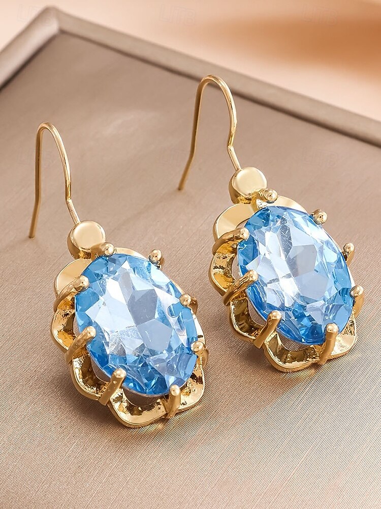 Boucles d'oreilles pendantes de Noël pour femmes avec de grandes pierres précieuses en cristal ovales, bijoux pendants élégants de couleur dorée, accessoires de fête festifs de 2025 ? $7.99 –P6