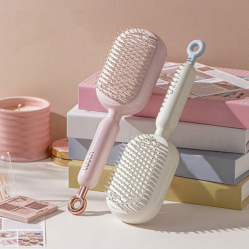 Peine de masaje con cojín retráctil, de diseño portátil para viajes. Cuenta con un anillo de tracción ergonómico, fácil de limpiar y masajeador con cojín de aire, ideal para desenredar cabello grueso 2026 - $16.99 –P1