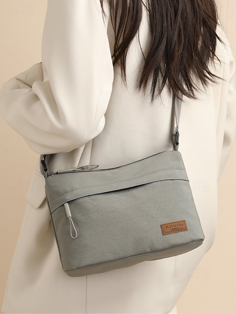 Bolsa transversal feminina em nylon, com grande capacidade, leve e com vários bolsos, ideal para o dia a dia, viagens, compras e uso na cidade. Estilo casual multicolorido. de 2026 por $9.99 –P3