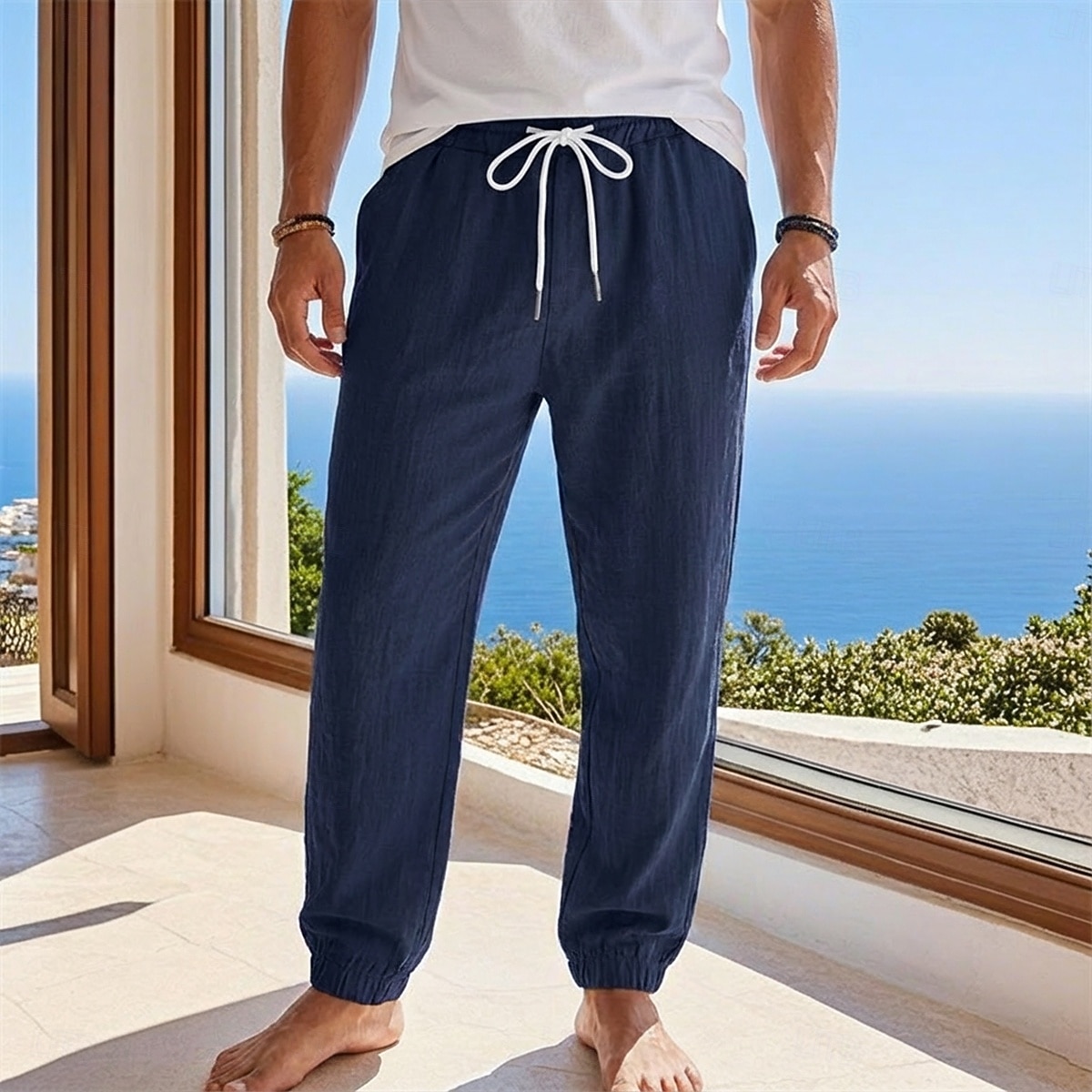 Homme Joggeurs Pantalons en Lin Pantalons Pantalon d'été Pantalons Amples Cordon de serrage Taille Élastique Uni Confort Léger Longueur complète Quotidien Plage Fête Vacances Mode Noir Blanche Non de 2026 ? $25.99 –P9