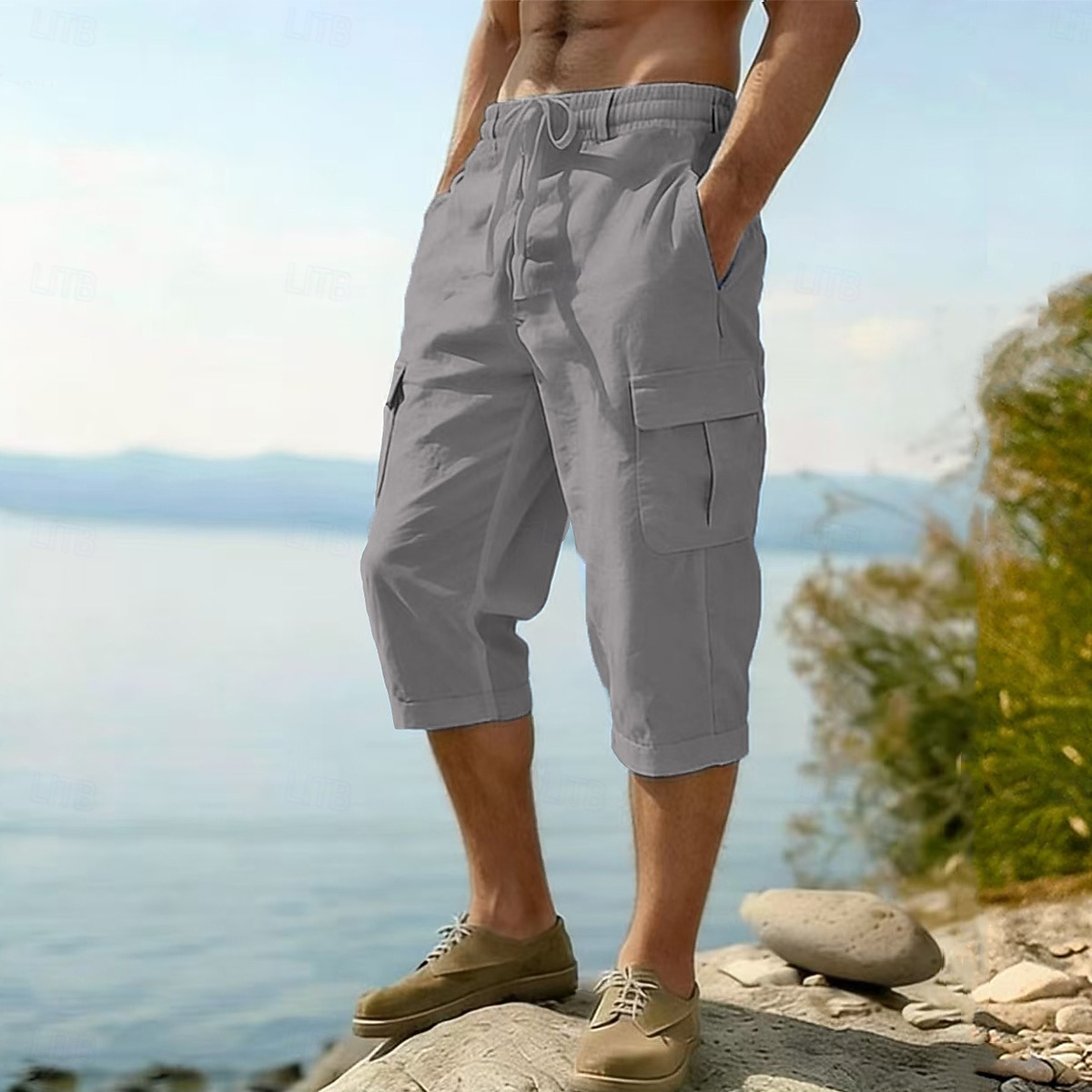 Homme Pantalons en Lin Pantalon capri Pantalon d'été Cordon de serrage Taille Élastique Multi-poches Uni Confort Respirant Longueur mollet Occasionnel Quotidien Extérieur Vacances Mode Bleu Noir Non de 2026 ? $24.99 –P2