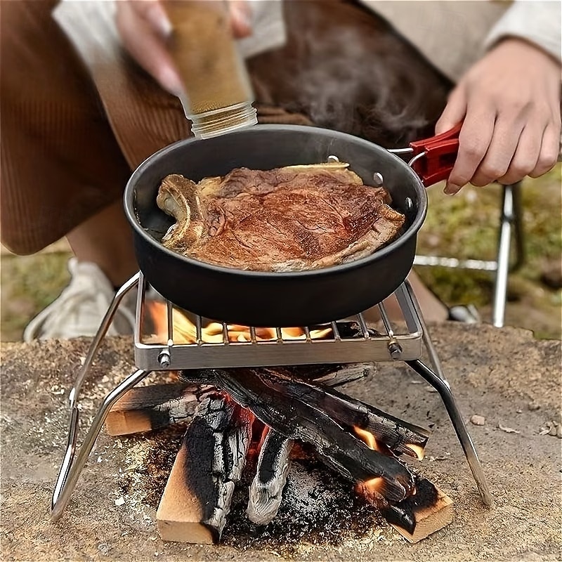 Opvouwbare roestvrijstalen vuurkorfstandaard voor buiten, beschermt voedsel tegen direct contact, geschikt voor kamperen, barbecueën, koken en verwarmen. Een essentieel accessoire voor buitenkoken. 2026 - $15.99 –P2