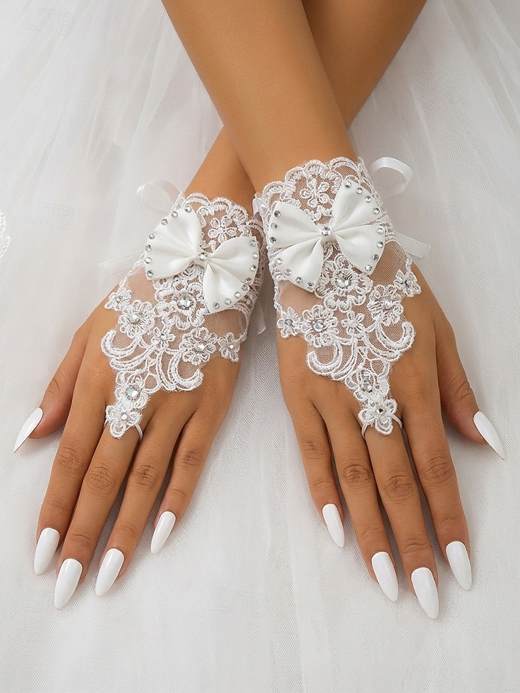 Luvas femininas de renda até o pulso, confeccionadas em poliéster, um elegante acessório para noivas, ideal para casamentos, festas e ocasiões especiais. de 2026 por CLP $10028 –P2