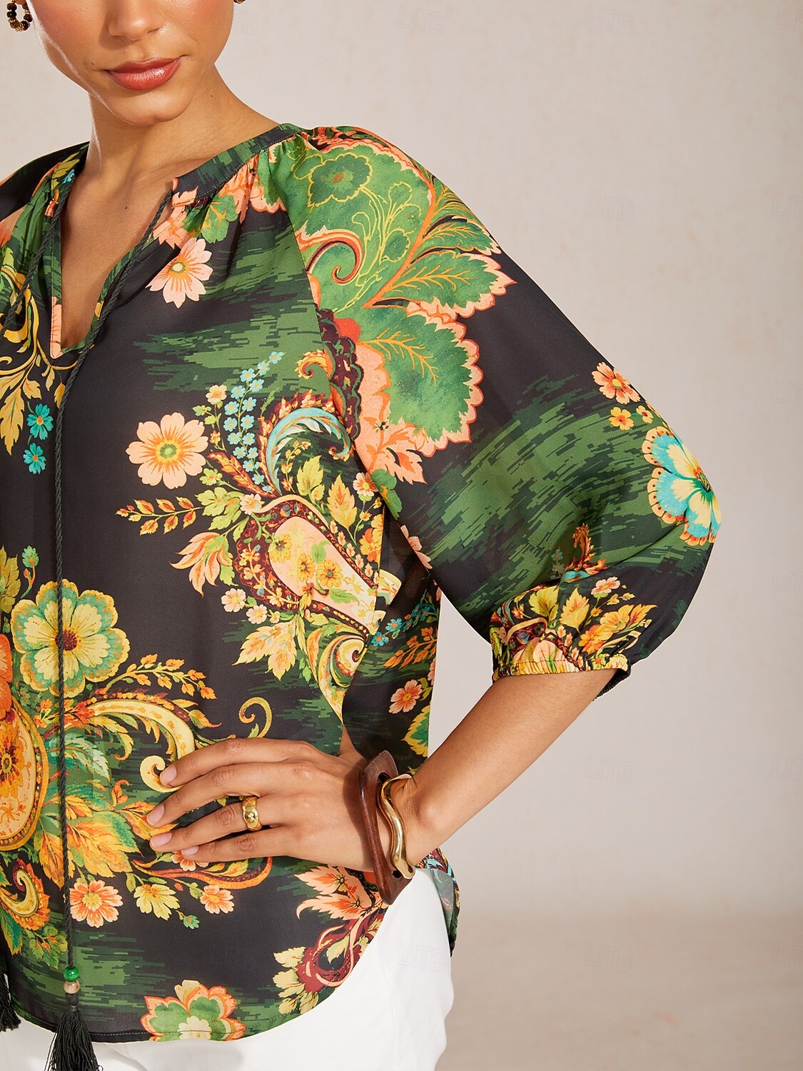 Top de gasa fluida con mangas raglán y estampado paisley. 2026 - $67.99 –P4