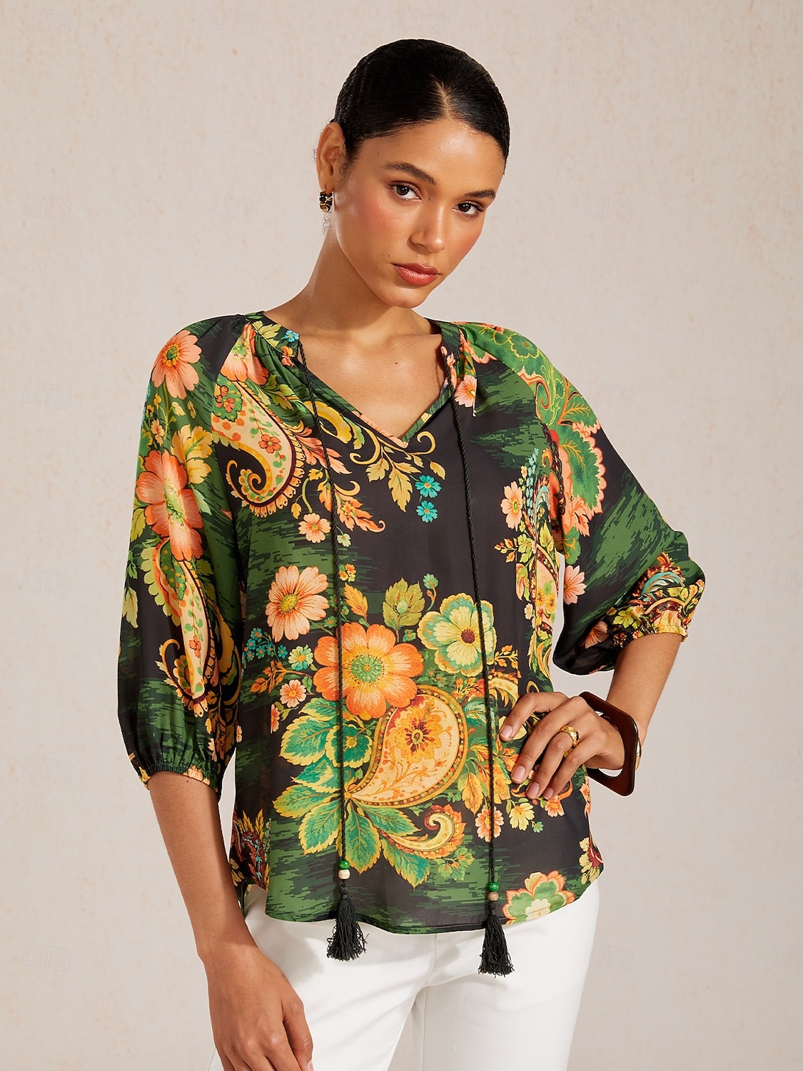Top de gasa fluida con mangas raglán y estampado paisley. 2026 - $67.99 –P8