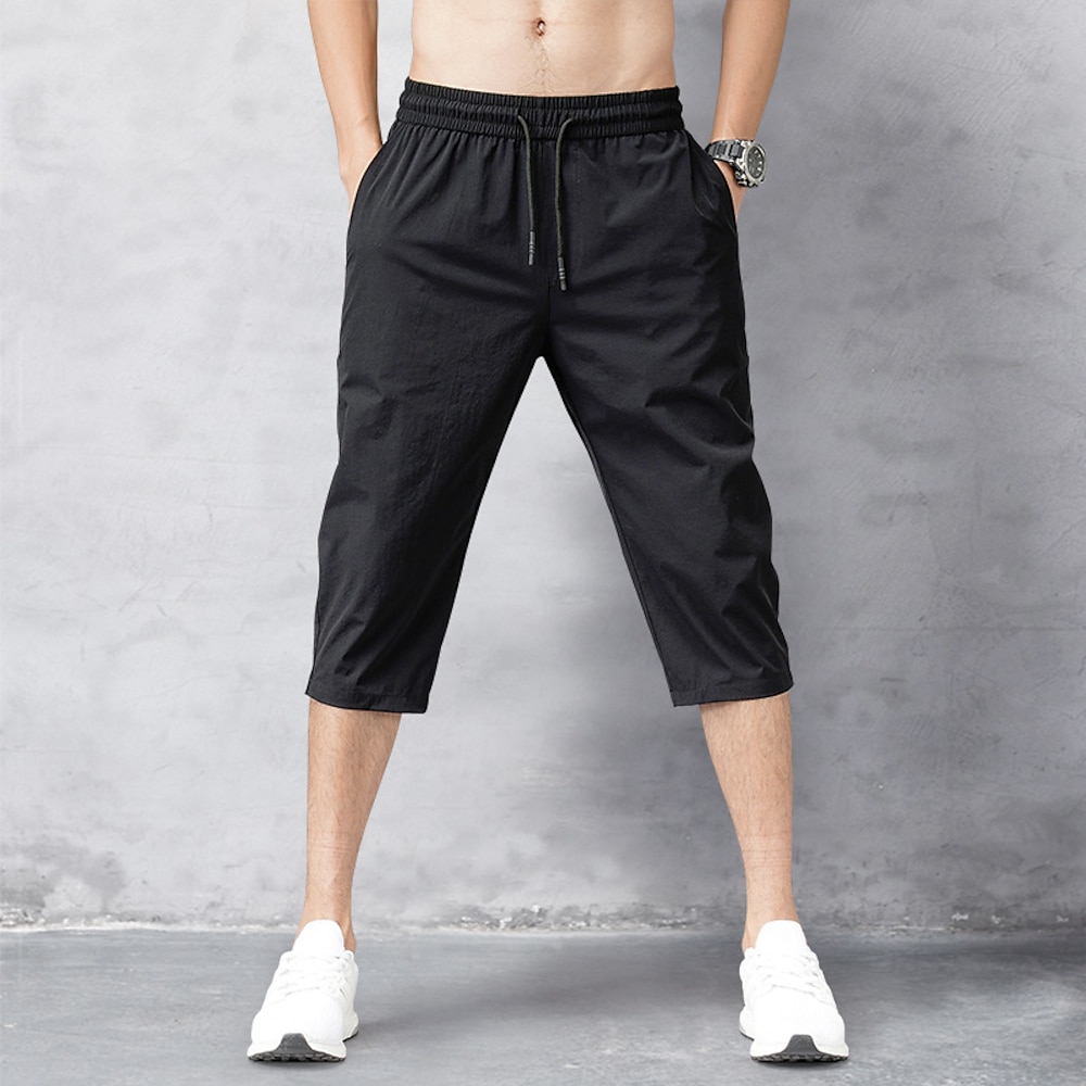 Herren Abgeschnittene Hose Caprihose Tasche Kordelzug Elastische Taille Glatt Komfort Sport Täglich Freizeit Sport Festtage Stilvoll Klassicher Stil Schwarz Hellgrau Lightinthebox