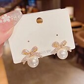 abordables Boucles d&#039;oreilles-Femme Boucles d&#039;oreille Clou Le style rétro Nœud Elégant Le style mignon mode Luxe Doux Des boucles d&#039;oreilles Bijoux Blanche Pour Carnaval Mariage Soirée 1 paire