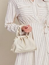 levne Kabelky a tote tašky-dámská elegantní krémová kabelka se zapínáním na šňůrku – stylová a všestranná kabelka pro každodenní použití