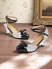 halpa 1950-luvun retrotyyli-Naisten tummansiniset pilkulliset 1950-luvun vintage-nilkkaremmillä varustetut korkokengät, joissa musta rusetti ja retrokorko, pin-up-tyyliin, teekutsuille ja erityistilaisuuksiin