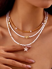abordables Collar de mujer-Conjunto de collar y pulsera tobillera en capas estilo playa para mujer con dijes de estrellas de mar y conchas, diseño de cuentas doradas y blancas, adecuado para vacaciones de verano, estilo casual y bohemio.