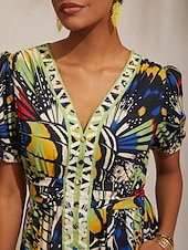  Maxikleid im Dschungel-Schmetterlings-Look aus luftigem Leinen.