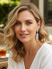 abordables Pendiente de mujer-Pendientes colgantes de hoja turquesa de aleación estilo boho para mujer, pendientes llamativos de plumas de estilo western vintage para uso casual, viajes, vacaciones y estilo resort.