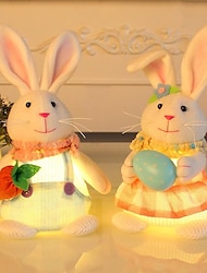 wielkanocna rzeźba królika stojącego z żywicy króliczek rysunkowy trzymający świecące jajko i marchewkę, urocza ozdoba na biurko