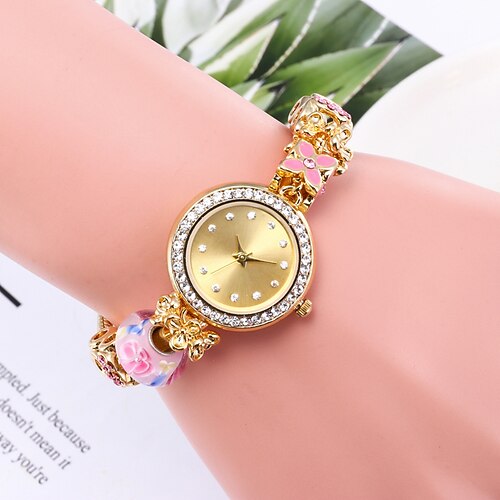 

Quarz-Armbanduhr mit Strass-Dekor, Herz-Zeiger-Hohlmanschetten-Armband-Kleideruhr