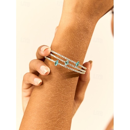 vergoldetes Kupferarmband für Damen mit blauem Zirkon - eleganter Schmuck für formelle und legere Anlässe