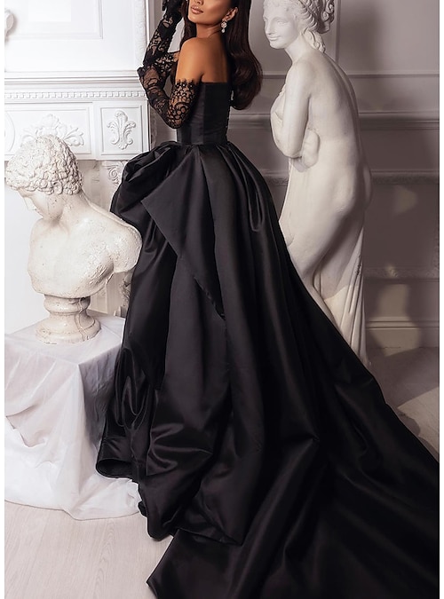Black Plus Size long sleeve ball gown from Darius Cordell