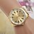 abordables Montres femme-Hommes / Femme / Unisexe Montre Tendance Quartz Alliage Bande Doré Marque-