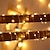 abordables Tiras de Luces LED-luces de cadena solares al aire libre 12m 7m con energía solar ip65 tubo de cuerda luces de cadena iluminación al aire libre luces flexibles de hadas a prueba de agua 50/100 leds para jardín garland