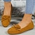 voordelige Platte damesschoenen-Zwarte mocassins van synthetisch leer voor dames met strikdetail, instappers voor dagelijks gebruik en comfort