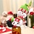 abordables Figuras coleccionables-Fundas navideñas para botellas, decoración del hogar, fundas navideñas para botellas con Papá Noel y muñeco de nieve, pequeños adornos para botellas de vino, decoraciones navideñas para botellas
