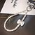 abordables Cordons et dragonnes pour téléphone-Nouvelle mode femme plein diamant lumière luxe noeud clip diamant anneau téléphone chaîne poignet suspendu chaîne téléphone corde courte