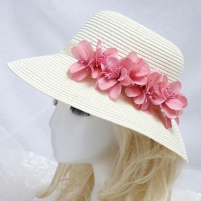  cappello del sole sul mare delle donne con il fiore rosa