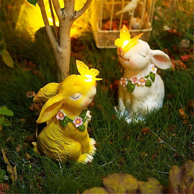  sol lys kanin have statuer og figurer udendørs kanin holder en sommerfugl sol lys til haveindretning udendørs udendørs statuer og skulpturer til haven påskehare udendørs indretning til gårdsplæne