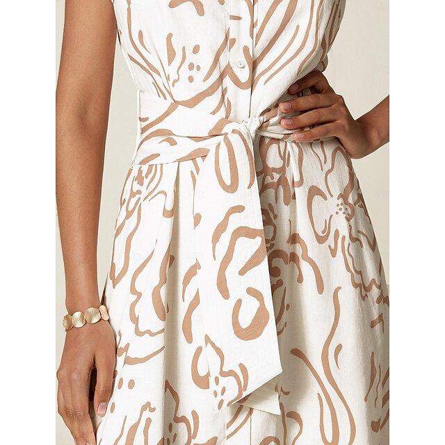 Maxi shirt dress with collar, long buttoned cuffs, waist tie, and side slits