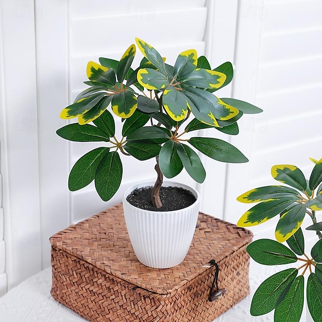  Verleihen Sie Ihrer Inneneinrichtung natürlichen Charme mit naturgetreuen Topfpflanzen mit Ficusblättern, die perfekt für die Schaffung einer heiteren und ruhigen Atmosphäre geeignet sind.