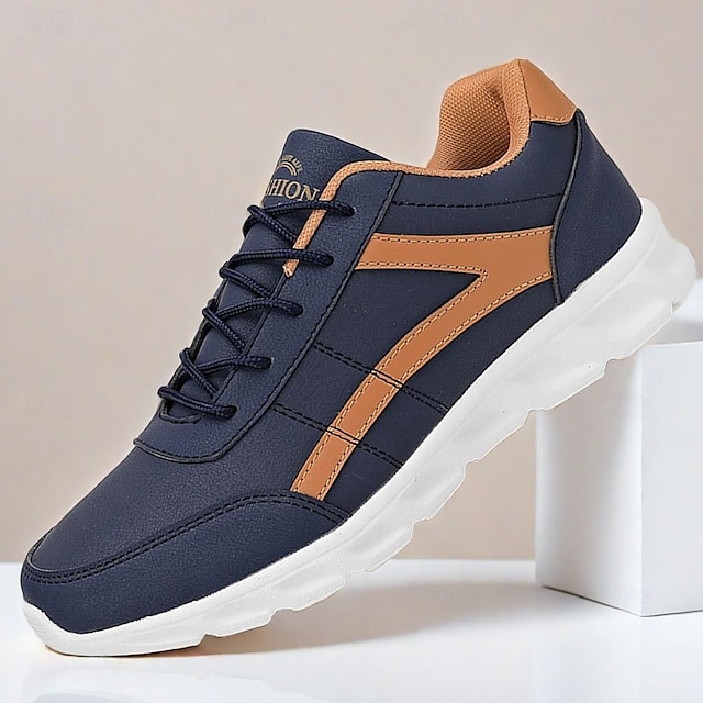  tênis esportivo masculino marinho e marrom com design leve para corrida e uso casual