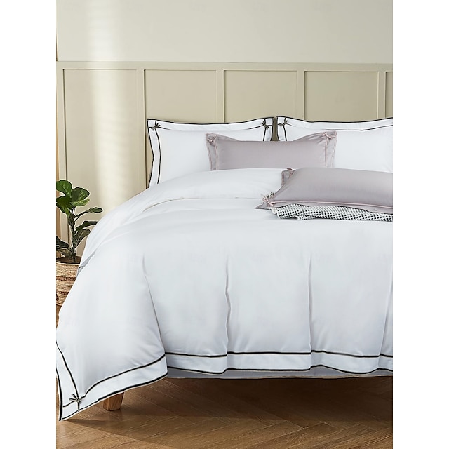  Set copripiumino da 4 pezzi, 100% cotone biologico, tessuto morbido e traspirante, include copripiumino e federe per un sonno confortevole.