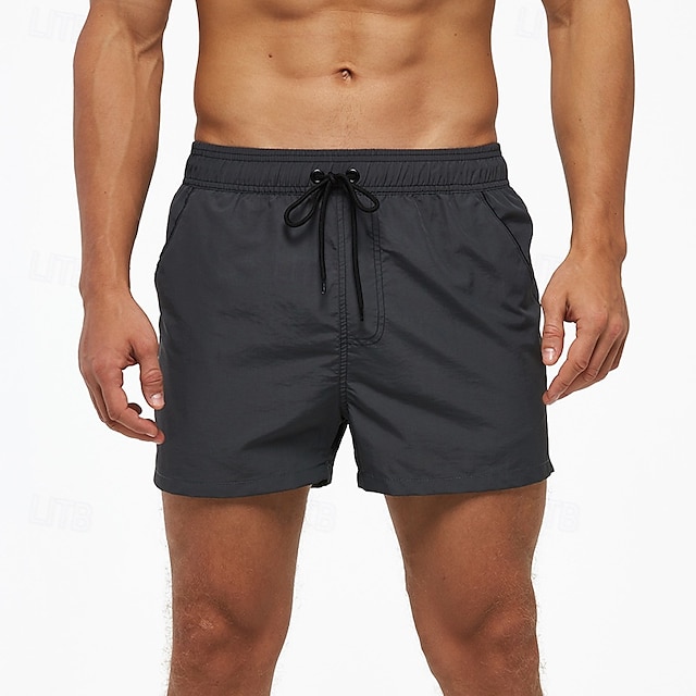  Per uomo Boxer da mare Pantaloncini da mare Boxer da surf Pantaloni A cordoncino Con tasche Nuoto Surf Spiaggia Sport acquatici Collage Tinta unita Estate Primavera