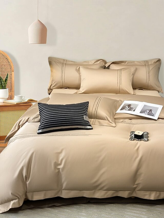  Set copripiumino da 4 pezzi, 100% cotone biologico, tessuto morbido e traspirante, include copripiumino e federe per un sonno confortevole.