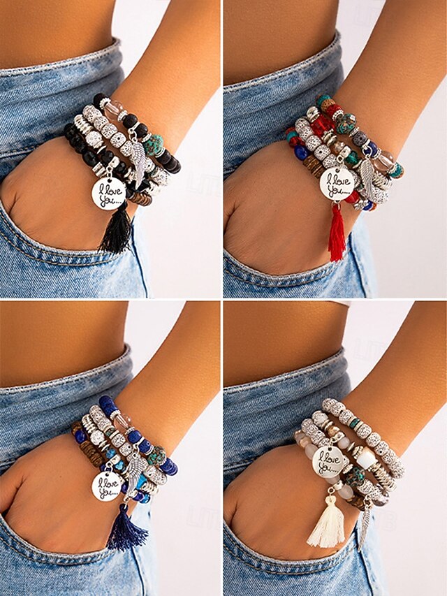  ensemble de bracelets multicouches en perles bohèmes pour femmes – bracelets à breloques colorés avec pompon et pendentif aile pour un usage décontracté et de plage