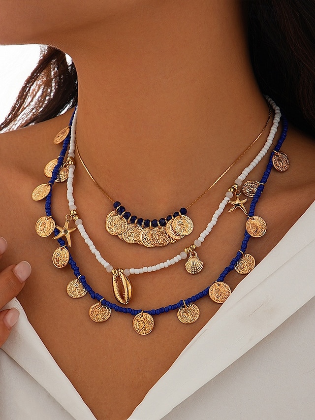  Ensemble de colliers à breloques coquillages et pièces de monnaie en perles dorées et bleues pour femmes – colliers superposés de style bohème de plage avec des accents d'étoiles de mer et de coquillages pour l'été et les vacances