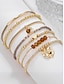 economico Bracciale da donna-set di braccialetti a strati con perline bohémien da donna: braccialetti multifilo in oro e marrone con accenti a forma di cuore e ciondolo, gioielli alla moda per feste, festival e uso quotidiano