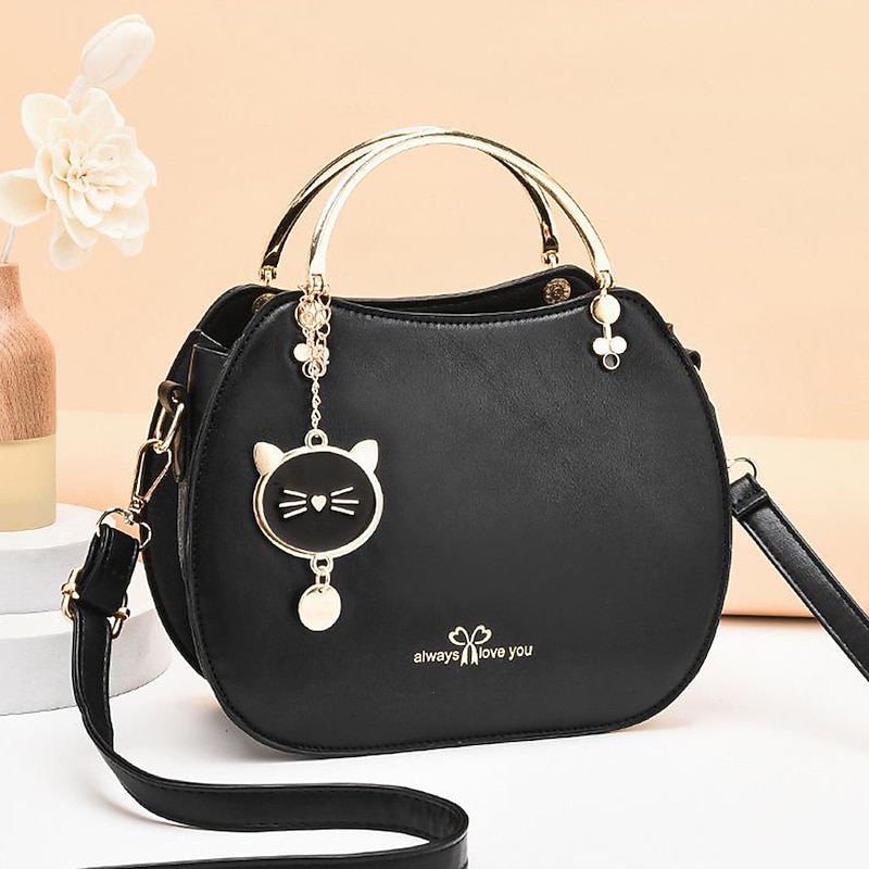 Women's Black Faux Leather Handbag with Gold Cat Charm and Metal Handle - Stylish Crossbody for Casual or Formal Use