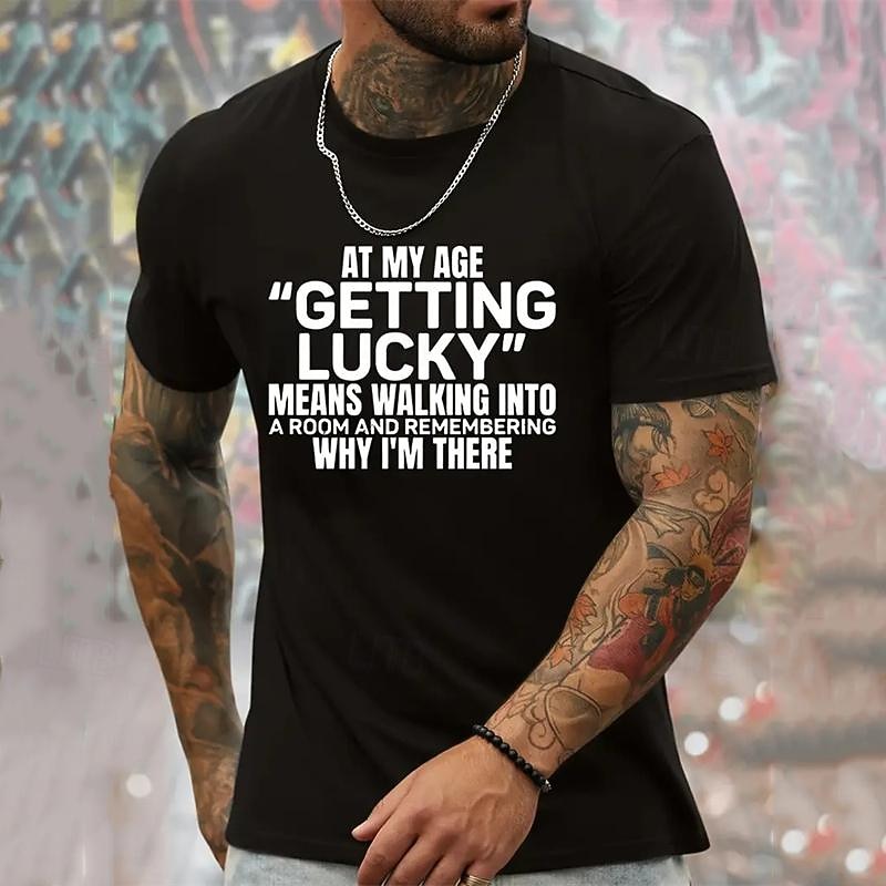 Humorous Men's Graphic T-Shirt featuring 'At My Age Getting Lucky Means Remembering Why I'm There' Quote, Funny Aging Lifestyle Short Sleeve2